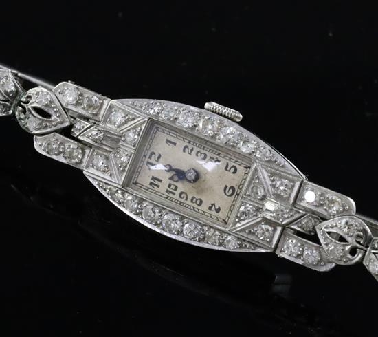 A ladys platinum and diamond set manual wind cocktail watch,
